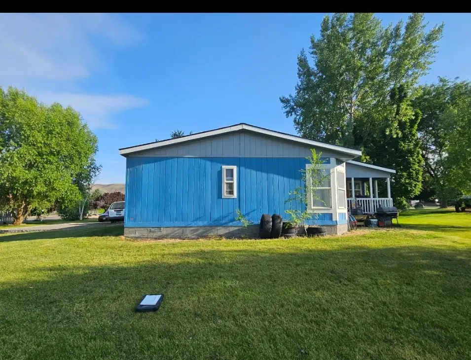 Before: original blue siding