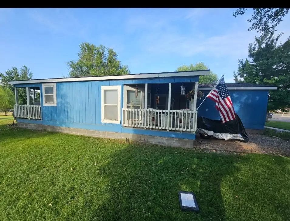 Before: front porch with blue siding